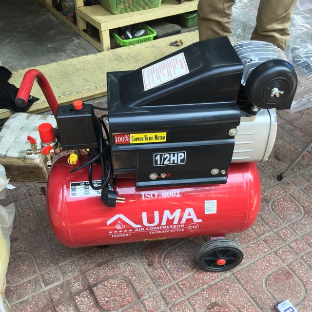 A red and black air compressor

Description automatically generated